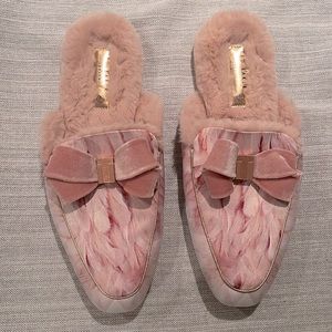 Ted Baker rose gold slippers with velvet bow.